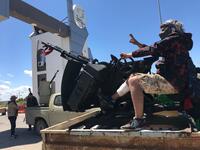 Forces loyal to the internationally recognised Libyan Government of National Accord (GNA) are pictured at the entrance gate leading to Tripoli's old airport on April 8, 2019. Mahmud TURKIA / AFP