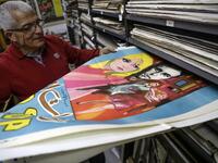 Abboudi Abu Jawdeh shows part of his vintage cinema poster collection at his office in the Lebanese capital Beirut  JOSEPH EID / AFP