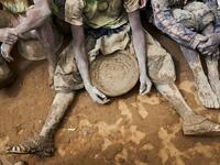 People take part in the annual rendering of the Great Mosque of Djenne in central Mali  MICHELE CATTANI / AFP