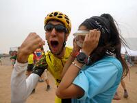 Sapin's Alex Roca Campillo celebrates with girlfriend at the end of Stage 5 of the 14th edition of Titan Desert 2019 mountain biking race between M’ssici and El Jorf, in Morocco, on May 2, 2019. Campillo is the first person living with cerebral palsy to participate in the Titan race. FRANCK FIFE / AFP