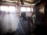 Elizabeth, a South Sudanese Refugee, poses inside a refugee transition camp in Aru for South Sudanese who have just arrived in the Democratic Republic of the Congo.  JOHN WESSELS / AFP