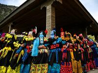 In this picture Kalash women wearing traditional dresses dance to celebrate 'Joshi', a festival to welcome the arrival of spring, at Bumburate village in the mountainous valleys in northern Pakistan. AAMIR QURESHI / AFP