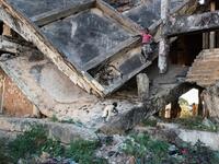 Children play on a derelict building, damaged during the Angolan civil war, in Kuito, Bie Province in central Angola. RODGER BOSCH / AFP