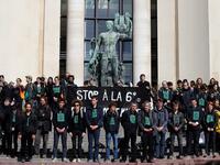 Members of the action group Extinction Rebellion (XR) hold a banner after spilling fake blood on the steps of the Trocadero esplanade during a demonstration to alert on the state of decline of biodiversity, on May 12, 2019 in Paris. FRANCOIS GUILLOT / AFP