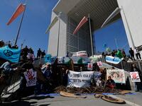 Activists of 'Extinction Rebellion' (XR) and NGO 'Planete Amazone' stage a protest against large hydroelectric dams in front of the Grande Arche de La Defense in Puteaux, northwest of Paris, on May 14, 2019, on the occasion of the 2019 World Hydropower Congress. The congress is held in Paris from May 14 to 16. FRANCOIS GUILLOT / AFP
