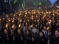 People take part in a torchlight procession as they mark the anniversary of the killing of 1.5 million Armenians by Ottoman forces, Yerevan, April 23, 2019. KAREN MINASYAN / AFP