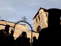 Greek Orthodox priests participate in the traditional Washing of the Feet ceremony in front of the church of the Holy Sepulchre, in Jerusalem's Old City, on April 25, 2019 as part of the Orthodox Holy Week celebrations.  GALI TIBBON / AFP