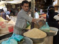 A Yemeni vendor sells grain in a market in the old city of the capital Sanaa, as the faithful prepare for the Muslim holy fasting month of Ramadan, on May 2, 2019. Mohammed HUWAIS / AFP