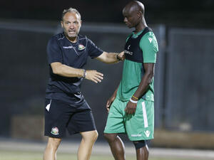 Harambee Stars coach Sebastien Migne and Dennis Odhiambo. (Photo: goal.com)