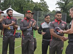 The UAE's Darius D'Silva receives his cap on his T20i debut against the Netherlands. - Twitter