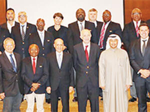 Chairman of FINA Julio Maglione with First Deputy Chairman of FINA Hussain Al-Musallam pose for a group photo during the FINA meeting in Kuwait.