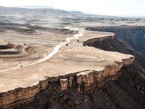 A Rallyist speeds past a scenic stage nine of the Dakar Rally on Tuesday, won by Frenchman Stephane Peterhansel. (Photo: Saudi Gazette)