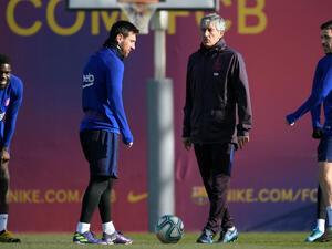 سيتيين وميسي خلال تدريبات برشلونة