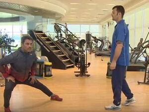 Rally driver Nasser Saleh al-Attiyah (left) stretches during Aspetar’s online training session.
