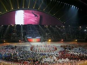 A general view of the Khalifa Stadium with the Qatari flag being displayed on a screen during the closing ceremony of the 15th Asian Games in Doha, December 15, 2006 (Photo: Gulf Times)
