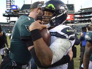 NFL players like Seattle Seahawks quarterback Russell Wilson (R) and Philadelphia Eagles quarterback Carson Wentz (L) must remain six feet apart and will not be allowed to trade jerseys after games during the 2020 season. (Photo: Derik Hamilton/UPI)