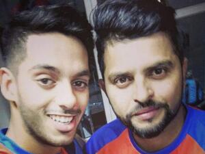 UAE opening batsman Chirag Suri with Suresh Raina. Suri was picked by Gujarat Lions in the 2017 IPL. (Supplied photo)