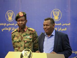 Spokesman of the Sudan's Transitional Military Council Lieutenant General Shamseddine Kabbashi (L) looks on as Sudanese protest leader Madani Abbas Madani speaks during a press conference in Khartoum on May 20, 2019. (AFP)