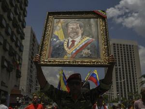 A government supporter attends a rally in the surroundings of Miraflores Presidential Palace in Caracas on May 20, 2019 to mark one year anniversary of Venezuela's President Nicolas Maduro's re-election. (Federico PARRA / AFP)