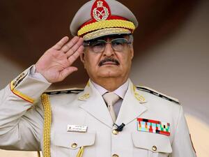 Libyan military commander Khalifa Haftar salutes during a military parade in Benghazi in May 2018. (AFP)