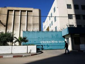 A Palestinian man walks past the building of the UNRWA headquarters in Gaza City on January 8, 2018. (MOHAMMED ABED/AFP/Getty Images)  A Palestinian man walks past the building of the UNRWA headquarters in Gaza City on January 8, 2018. (MOHAMMED ABED/AFP/Getty Images)