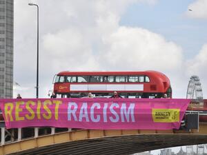 Banners created by UK based human rights organisation Amnesty International and unfurled over Vauxhall Bridge in central London on June 3, 2019 to coincide with the UK State Visit of US President Donald Trump and US First Lady Melania Trump. (AFP)