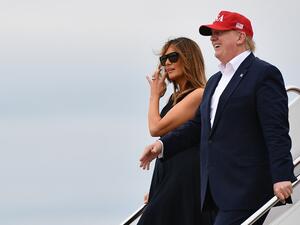 US President Donald Trump and First Lady Melania Trump step off Air Force One upon arrival at Andrews Air Force Base in Maryland on June 07, 2019. (MANDEL NGAN / AFP)