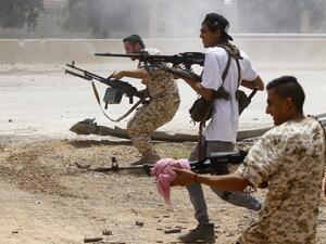 Fighters loyal to the internationally-recognised Government of National Accord (GNA) open fire from their position in the al-Sawani area south of the Libyan capital Tripoli during clashes with forces loyal to strongman Khalifa Haftar, on June 13, 2019. (Mahmud TURKIA / AFP)