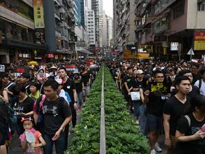 Thousands of protesters dressed in black take part in a new rally against a controversial extradition law proposal in Hong Kong on June 16, 2019. (AFP/ File Photo)