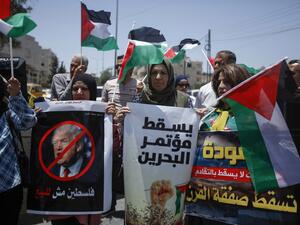 Palestinians hold banners and shout slogans as they rally against the US-led Israeli-Palestinian peace conference in Bahrain scheduled for next week, in Bethlehem in the occupied West Bank on June 20, 2019. (Musa AL SHAER / AFP)
