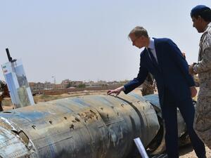 Brian Hook (2nd R), the US special representative on Iran, checks what Saudi officials said were Iranian remnants of a "cruise missile" that slammed into Abha airport on June 12, during a visit to an army base in al-Kharj, south of the Saudi capital Riyadh, on June 21, 2019. (AFP/ File Photo)