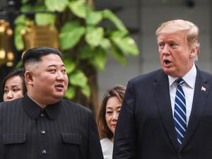 US President Donald Trump (R) walks with North Korea's leader Kim Jong Un during a break in talks at the second US-North Korea summit at the Sofitel Legend Metropole hotel in Hanoi on February 28, 2019. (AFP)