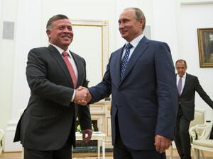 Russian President Vladimir Putin shakes hands with Jordanian King Abdullah II during a meeting at the Kremlin in Moscow (AFP)