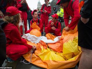 A Tommy Robinson supporter punctured the Baby Trump blimp flying over Parliament Square this afternoon. (Daily Mail)