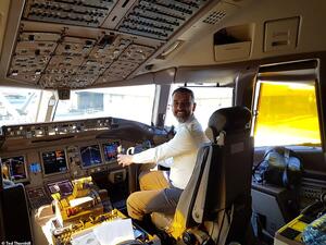 Ted at the controls of the Boeing 777 at Heathrow's Terminal 3 before it took him to Dallas. (Daily Mail)