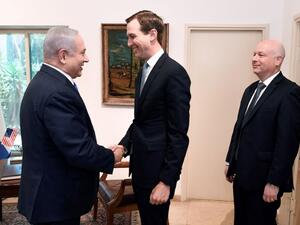 US President Donald Trump's son-in-law and adviser Jared Kushner shakes hands with Israeli Prime Minister Benjamin Netanyahu during a meeting in Jerusalem, with Trump's aide for international negotiations Jason Greenblatt looking on (AFP Photo)