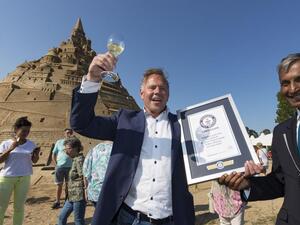 A sandcastle completed at the Sand Sculpture Festival in Binz, Germany, on Wednesday was dubbed the tallest sandcastle in the world by Guinness World Records. (Photo by Jens Koehler/EPA-EFE)