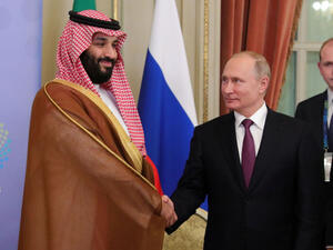 This week’s OPEC+ meeting could see another friendly handshake between Saudi Arabian Crown Prince Mohammed bin Salman and Russian President Vladimir Putin, pictured here on Dec. 1. (Mikhail Klimentyev/AFP/Getty Images) 
