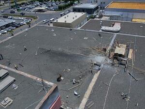 the damage on the roof of Abha airport one day after Yemeni rebel missile attack on the civil airport wounded 26 civilians. (Fayez Nureldine / AFP)