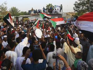 Sudanese people chant slogans and wave national flags as they celebrate after protest leaders struck a deal with the ruling generals on a new governing body, in the capital Khartoum's eastern district of Burri on July 5, 2019.(AFP/ File Photo)