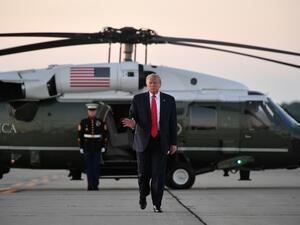 US President Donald Trump makes his way to board Air Force One before departing from Cleveland Hopkins International Airport in Cleveland, Ohio on July 12, 2019. (MANDEL NGAN / AFP)