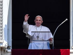 Pope Francis waves to the crowd from the window of the apostolic palace overlooking St Peter's square during the Sunday Angelus prayer, on July 14, 2019 in Vatican. (Andreas SOLARO / AFP)