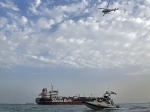 Iranian Revolutionary Guards patrolling around the British-flagged tanker Stena Impero as it's anchored off the Iranian port city of Bandar Abbas  (AFP)