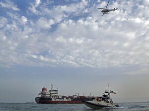 Iranian Revolutionary Guards patrolling around the British-flagged tanker Stena Impero as it's anchored off the Iranian port city of Bandar Abbas  (AFP)