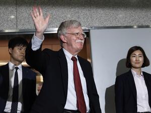 US National Security Advisor John Bolton (C) waves as he leaves after a meeting with South Korea's foreign minister at the Foreign Ministry in Seoul on July 24, 2019.  Ahn Young-joon / POOL / AFP