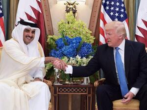 U.S. President Donald Trump (R) and Qatar's Emir Sheikh Tamim Bin Hamad Al-Thani take part in a bilateral meeting at a hotel in Riyadh on May 21. (AFP/ File Photo)