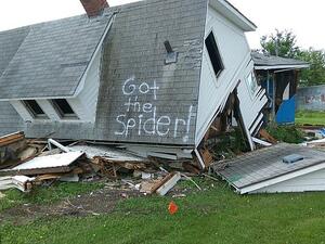 The words, 'Got the Spider!' were painted on the home's roof. (Facebook)