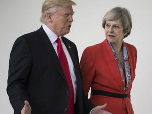 US President Donald Trump and British Prime Minister Theresa May walk at the White House on January 27, 2017 in Washington, DC. (Brendan Smialowski, AFP)