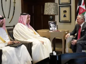 King Abdullah II, right, receiving Qatar's Deputy Prime Minister Khalid bin Mohammed Al-Attiyah, centre, in Amman on 17 April (AFP)