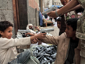 Children playing with toy guns on the street of Sanaa (Shutterstock)	
